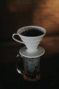 Close-up of coffee cup on table