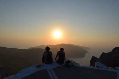 Tourists looking at sunset