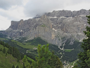 Scenic view of mountains against cloudy sky