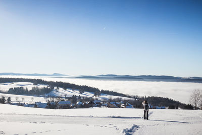 View of the snow-capped village of giron in the french jura in winter