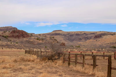 Scenic view of landscape and mountains against sky