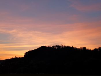 Silhouette trees against sky during sunset