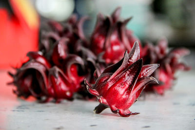 Close-up of red chili peppers on table