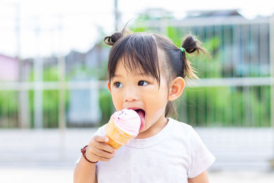 Close-up of girl eating ice cream