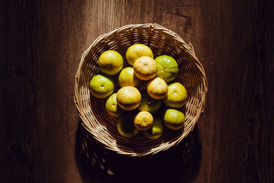 High angle view of apples in basket on table