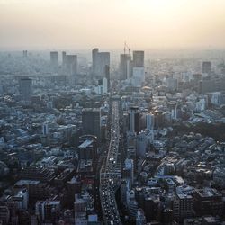 High angle view of modern buildings in city against sky