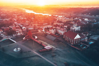 High angle view of city street against sky at sunset
