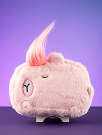 Close-up of stuffed toy against blue background