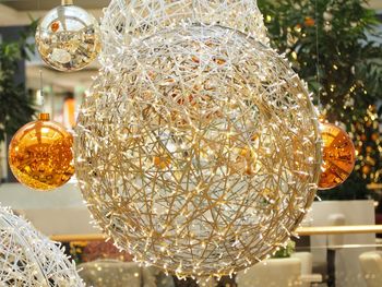 Close-up of illuminated christmas lights hanging on ceiling
