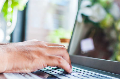 Close-up of man hand on table