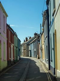 Empty alley amidst buildings in city