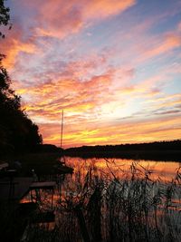 Scenic view of lake against orange sky