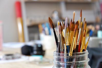 Close-up of paintbrushes in jar