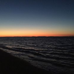 Scenic view of sea against sky at sunset