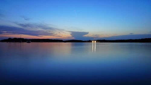 Scenic view of sea against blue sky during sunset