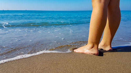 Low section of woman on beach