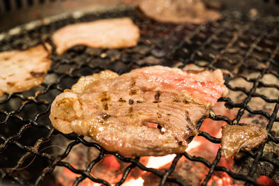 High angle view of meat on barbecue grill