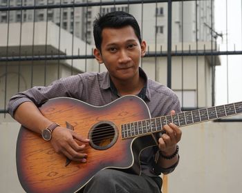 Young man playing guitar