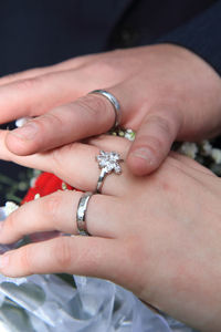 Close-up of couple holding hands