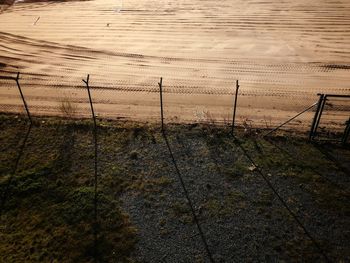 Scenic view of field seen through fence