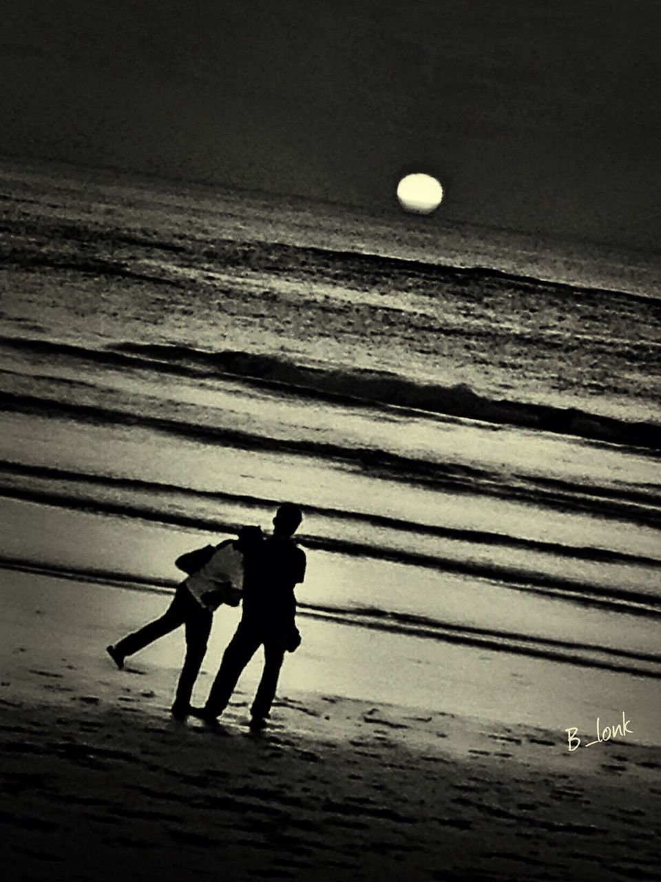 sea, water, silhouette, horizon over water, sunset, full length, men, leisure activity, tranquility, lifestyles, beach, tranquil scene, sky, night, nature, scenics, pier, outdoors