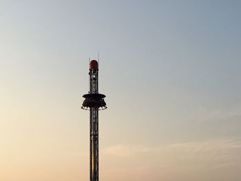 Low angle view of communications tower against clear sky