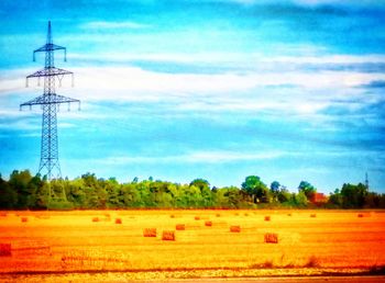 Scenic view of field against cloudy sky