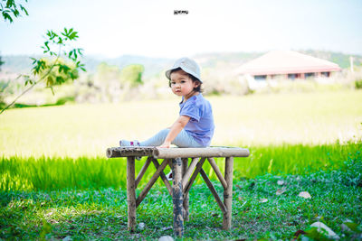 Full length portrait of boy on field