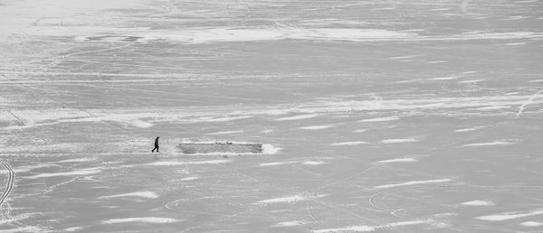 Ice skating on a frozen lake in winter