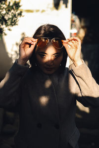 Portrait of woman wearing sunglasses