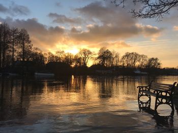 Scenic view of lake against sky during sunset