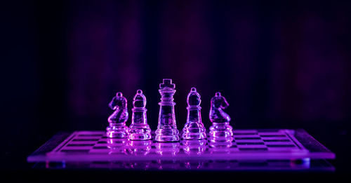 Close-up of chess pieces on table