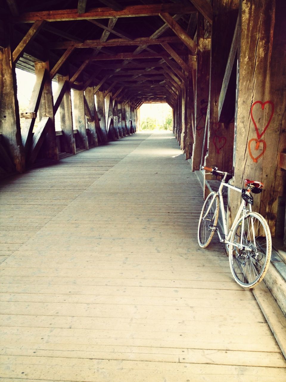 architecture, built structure, the way forward, transportation, bicycle, diminishing perspective, vanishing point, land vehicle, mode of transport, indoors, railing, old, building exterior, wall - building feature, no people, stationary, day, empty, abandoned, bridge - man made structure