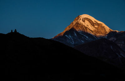 Scenic view of volcanic mountain against clear sky