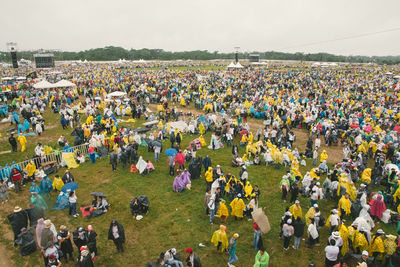 High angle view of crowd at concert against sky