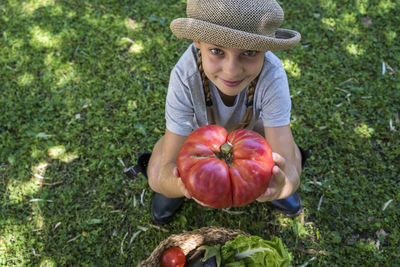 Portrait of boy wearing hat on field