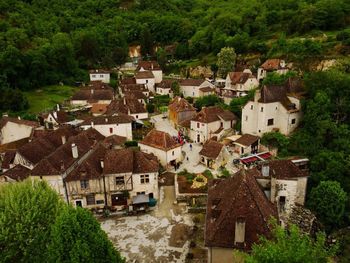 High angle view of houses and trees in village