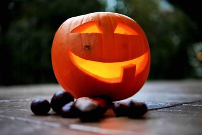 Close-up of pumpkin against orange halloween