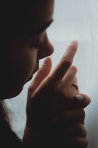 Close-up portrait of man holding hands