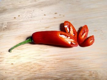 Close-up of red chili peppers on table