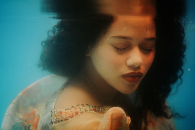 Portrait of young woman in swimming pool