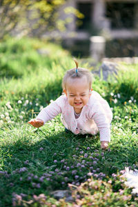 Cute baby girl on field