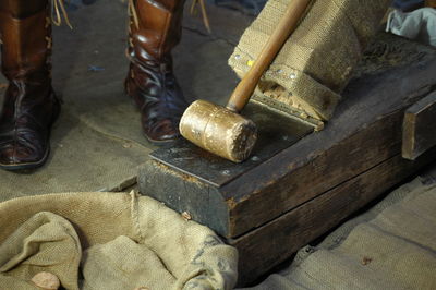 Low section of man working on wood