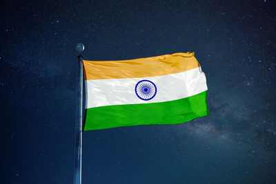 Flag on umbrella against star field at night
