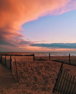 Scenic view of landscape against cloudy sky