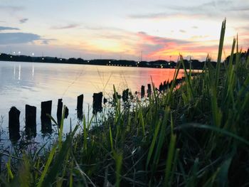 Scenic view of lake against sky during sunset