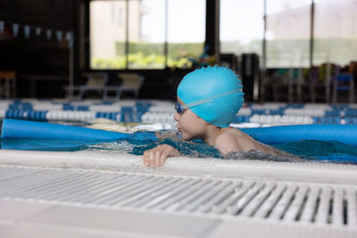 Man swimming in pool