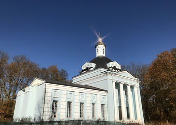 Low angle view of building against clear blue sky