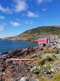 Scenic view of sea against blue sky