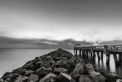 Pier over sea against sky